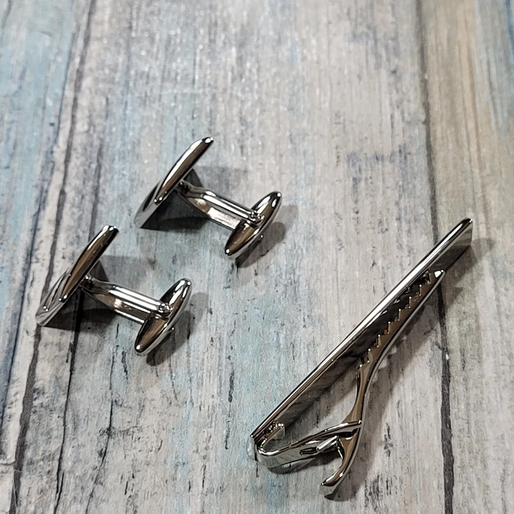Cuff Links and Tie clip.